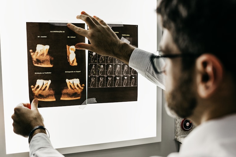 Dentist examining dental X-rays